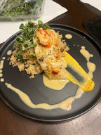 Halibut w/ roasted chick pea and kale quinoa and a butternut squash puree. Topped with a scallop and shrimp cream sauce