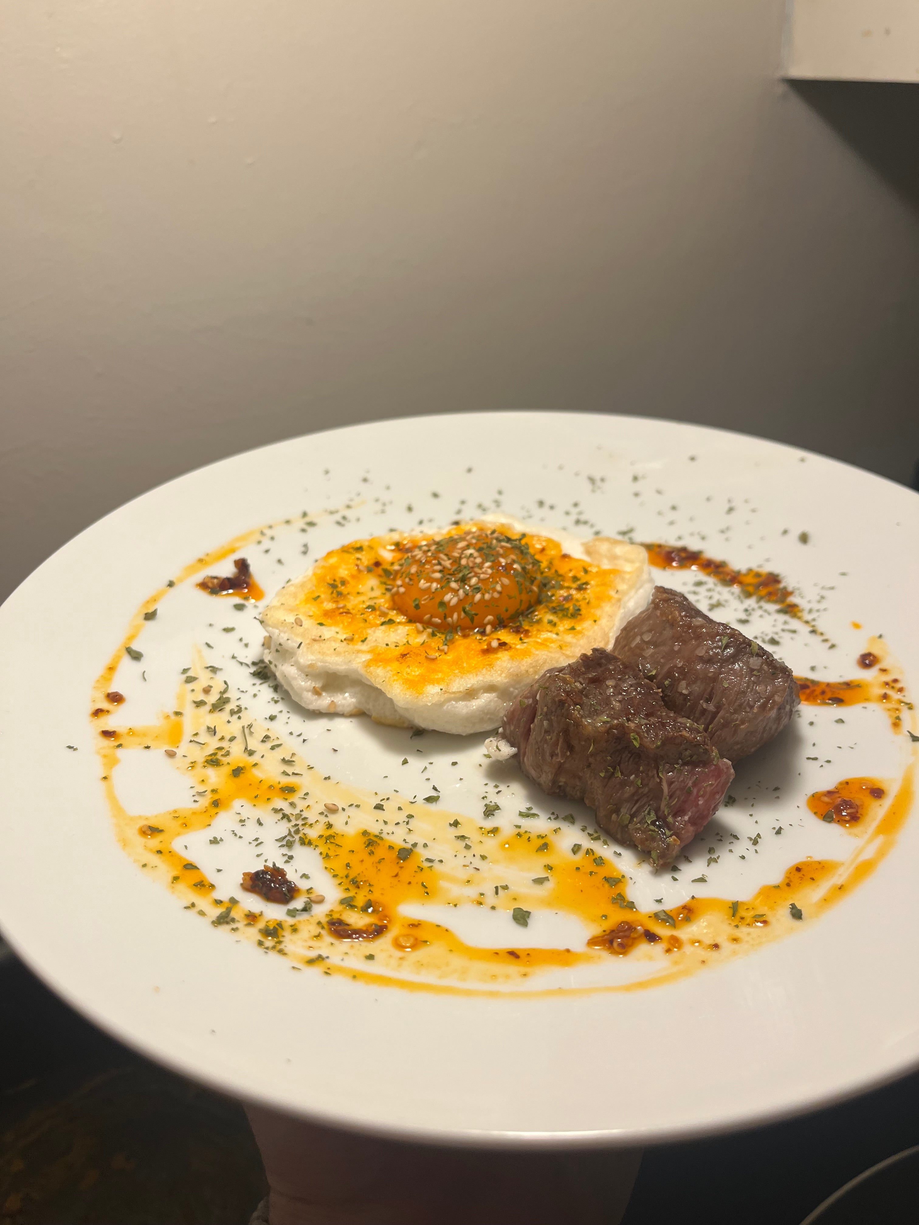Fluffed egg white Steak n Eggs with chili oil
